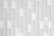 Abstract background of white or gray ceramic tiles for walls and floors.Simple seamless pattern.