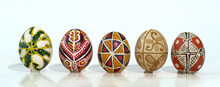 Five Painted Eggs Stand In A Line.