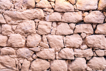 Wall Mural - Stone wall painted background, texture. Old stonewall traditional pattern building facade, material