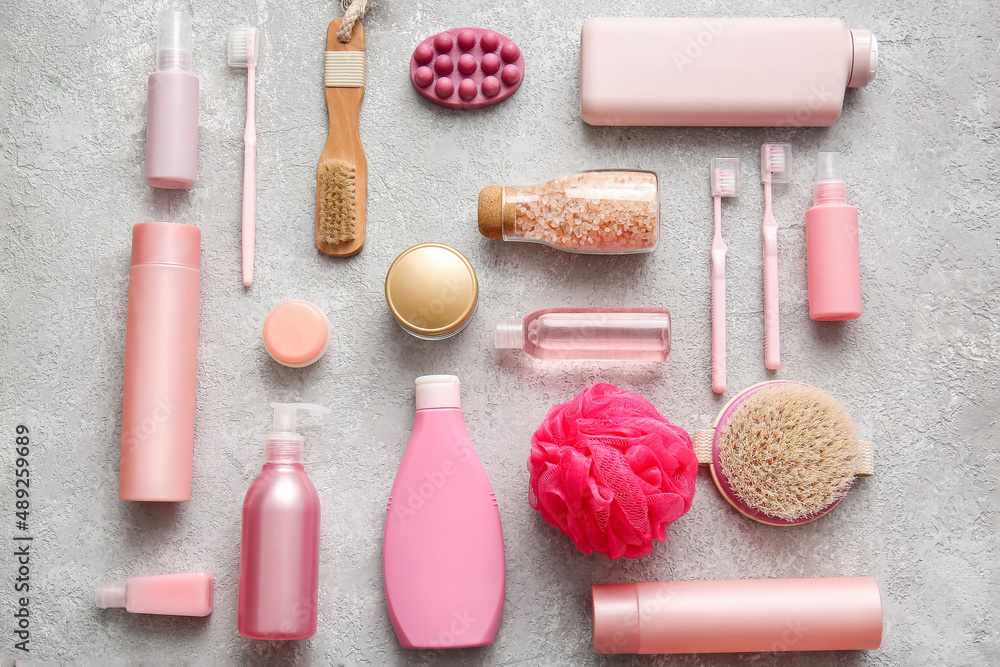 Composition with bath supplies and cosmetic products on light background