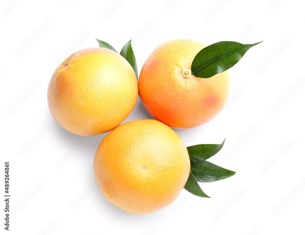 Fresh whole grapefruits on white background
