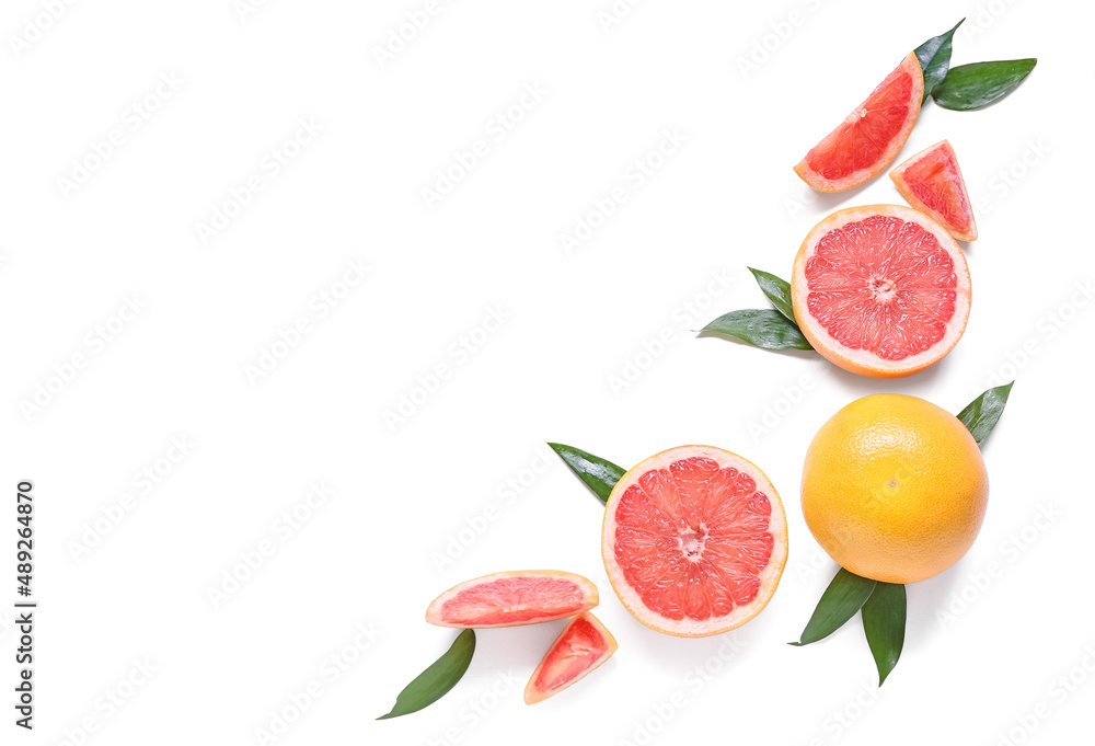 Fresh grapefruit pieces on white background