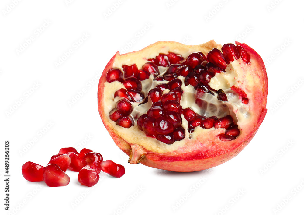 Half of tasty pomegranate on white background