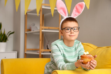 Poster - Cute little boy with bunny ears and Easter cake at home