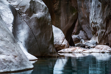 Wall Mural - mysterious narrow rocky canyon with blue water at the bottom, Göynük, Turkey