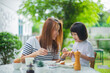 © waranyu - Mother have breakfast with her children, family time