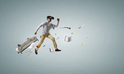 Wall Mural - Man wearing virtual reality goggles