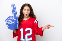 Little Sports Fan Girl Isolated On White Background Surprised And Pointing Side