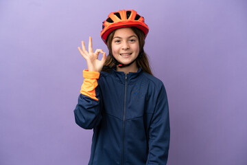 Wall Mural - Little caucasian girl isolated on purple background showing ok sign with fingers