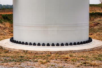 nuts and bolts of the wind turbine at foot many pance for a strong foundation.