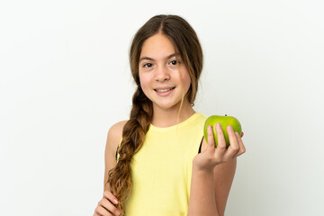 Wall Mural - Little caucasian girl isolated on white background with an apple and happy