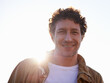 © M S/peopleimages.com - Is it me youre looking for. A cropped portrait of a handsome man standing outdoors.