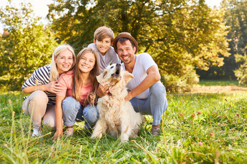 Wall Mural - Happy family with two children and dog