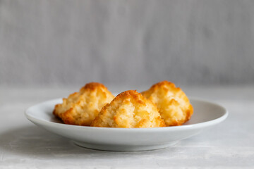 Sticker - coconut cookies on a small saucer on ceramic