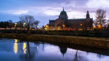 Sticker - Galway, Ireland. Beautiful landscape of Galway, Ireland. River and famous Galway Cathedral with cloudy colorful sky. Time-lapse during the sunset