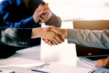 Business handshake for teamwork of business merger and acquisition,successful negotiate,hand shake,two businessman shake hand with partner to celebration partnership and business deal concept