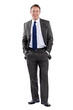 © Stigur/peopleimages.com - Business is good. Full length portrait of a businessman standing with his hands in his pockets against a white background.