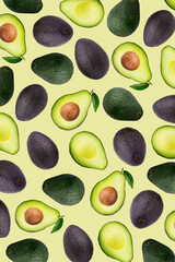 Wall Mural - Slices and half of avocado on a yellow wallpaper background.