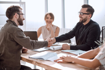 Poster - handshake business people at a meeting in the office