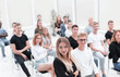 © ASDF - top view. audience of young people sitting in the conference room.