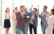 © ASDF - happy young business man accepting congratulations from his colleagues.
