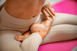 © svetograph - Close up hand and half body of healthy woman sit in lotus Yoga position.Young healthy woman sitting posture exercise in home.Concept of meditating,lifestyle and relaxation.