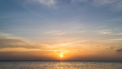 Wall Mural - sunset over the sea in the evening with colorful orange sunlight clouds
