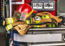 Firefighter Coat And Helmet On The Fire Truck