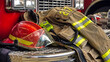 Firefighter coat and helmet on the fire truck
