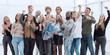 © ASDF - large group of happy young people showing their success