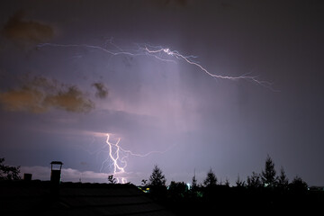 Sticker - Several lightning bolts cut through the night sky over Transylvania, Romania during a thundery night