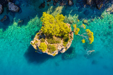 Wall Mural - mediterranean sea. aerial view on the beach and rocks. top view from drone at beach and azure sea. t