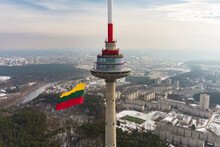 VILNIUS, LITHUANIA - FEBRUARY 16, 2022: Giant Tricolor Lithuanian Flag Waving On Vilnius Television Tower On The Celebration Of Restoration Of The State Day.