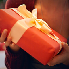 Canvas Print - Just for you. Closeup shot of a woman holding a present wrapped in a bow.