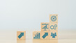 © LOVEis - stacking wooden cube with improvement icon standing with goal. plan, action, and improvement concept.