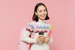 © ViDi Studio - Teen student girl of Asian ethnicity wearing sweater backpack hold books hold takeaway delivery craft cup coffee to go isolated on pastel plain pink background Education in university college concept