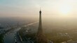 Establishing Aerial Panorama of Paris Cityscape with Eiffel Tower as main Landmark Monument of Capital of France and Famous Travel Destination. Parisian Architecture Skyline. 4K drone zoom out shot