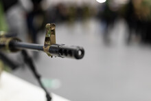 The Muzzle With The Sight Of An Army Assault Rifle Is Pointed At The Camera. Close-up Of The Weapons, Background Blurred., Copyspace