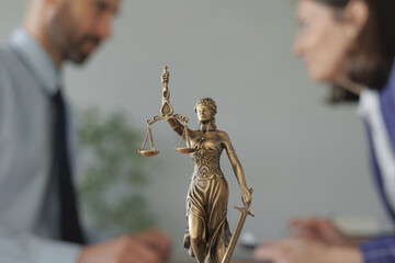 a female lawyer at a meeting with a male client in the office of the law office, legal advice online. resolution of disputes of the family code during divorce and division of property. work as a