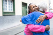 © Vane Nunes - Multiracial senior women hugging each other - Elderly diverse community concept - Focus on african female face