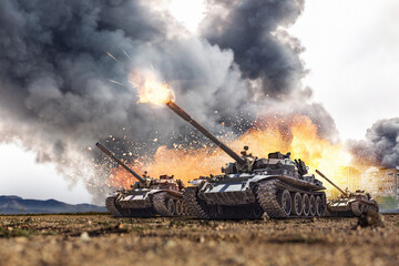 Group of main battle tanks with a city on fire on the background. One tank firing a shell from the barrel. Military or army special operation