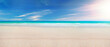Seascape beach background. Blue sea in clear sky day. Focus on sand foreground.