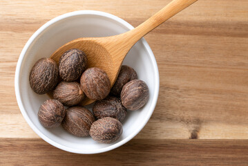 Wall Mural - Whole Nutmeg in a Bowl