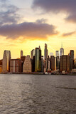 Fototapeta Miasta - Beautiful sunset clouds over Manhattan skyline in New York City shot across the river Hudson in New York City 