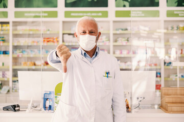 Wall Mural - An old pharmacy worker displeased with number of sick people.