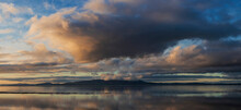 Beautiful Sunset Landscape Image Of Solway Firth Viewed From Silloth During Stunning Autumn Sunset With Dramatic Sky And Cloud Formations
