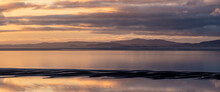 Beautiful Sunset Landscape Image Of Solway Firth Viewed From Silloth During Stunning Autumn Sunset With Dramatic Sky And Cloud Formations