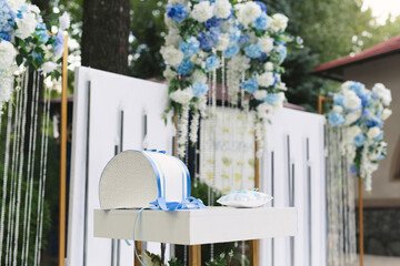 Wall Mural - Details of the wedding ceremony made of fresh flowers, sparkling beads. Delicate and beautiful wedding decor for newlyweds.