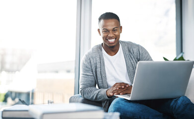Poster - Uncapped wifi at home What more do you need. Portrait of a happy young man using a laptop while relaxing at home.