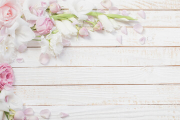 Wall Mural - pink and white flowers on white wooden background